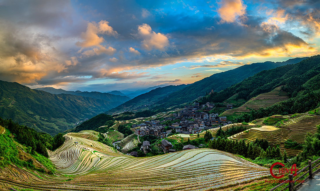 Rounded Longji terraces on the Ping'an side glowing in late light