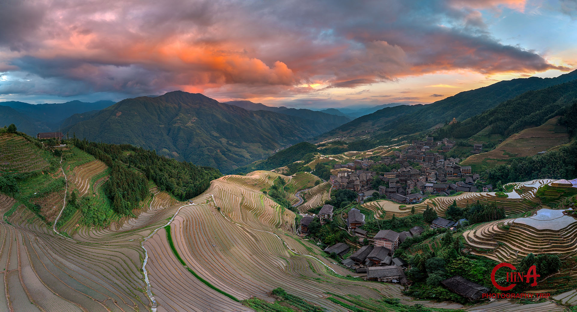 Longji rice terraces glowing at sunset above Jinkeng Dazhai village