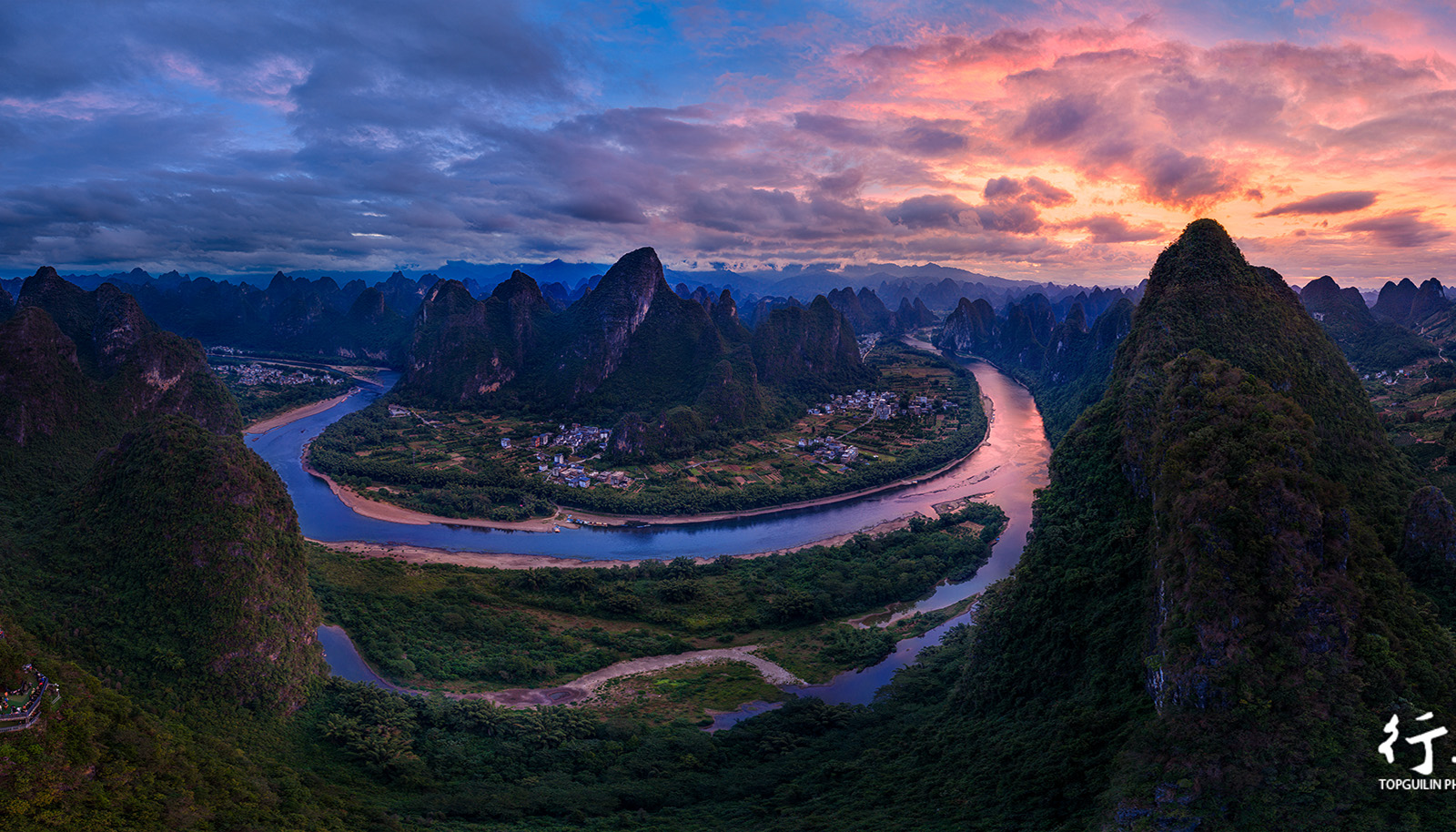 The Li River bend and layered karst ridges at dawn from Xianggong Hill