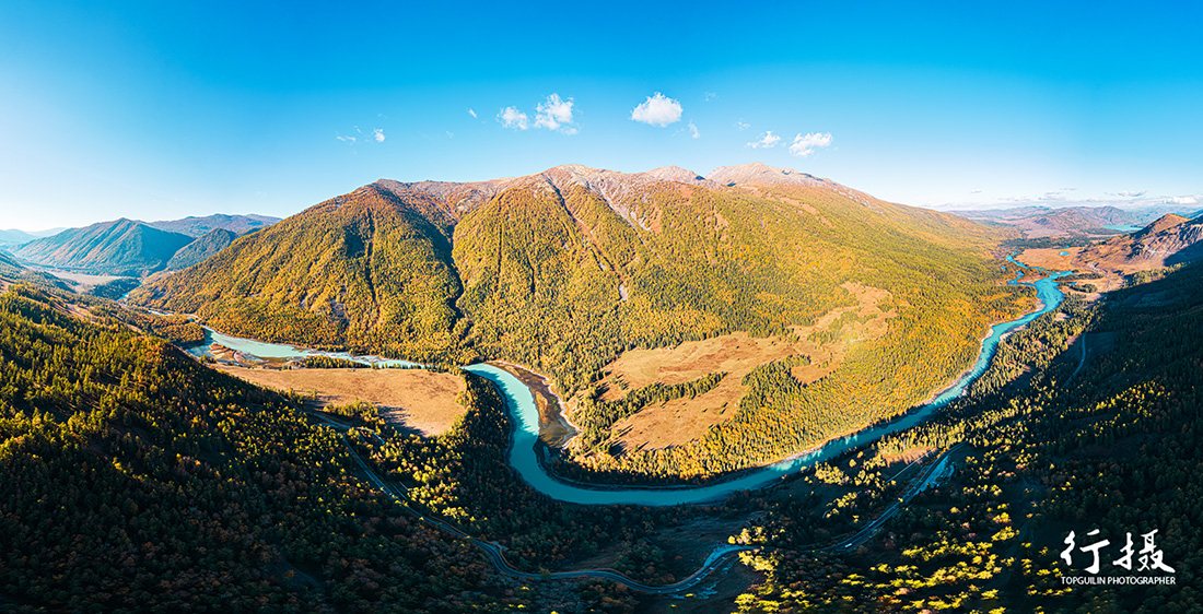 Wolong Bay, the sleeping-dragon island in the Kanas River surrounded by autumn forest