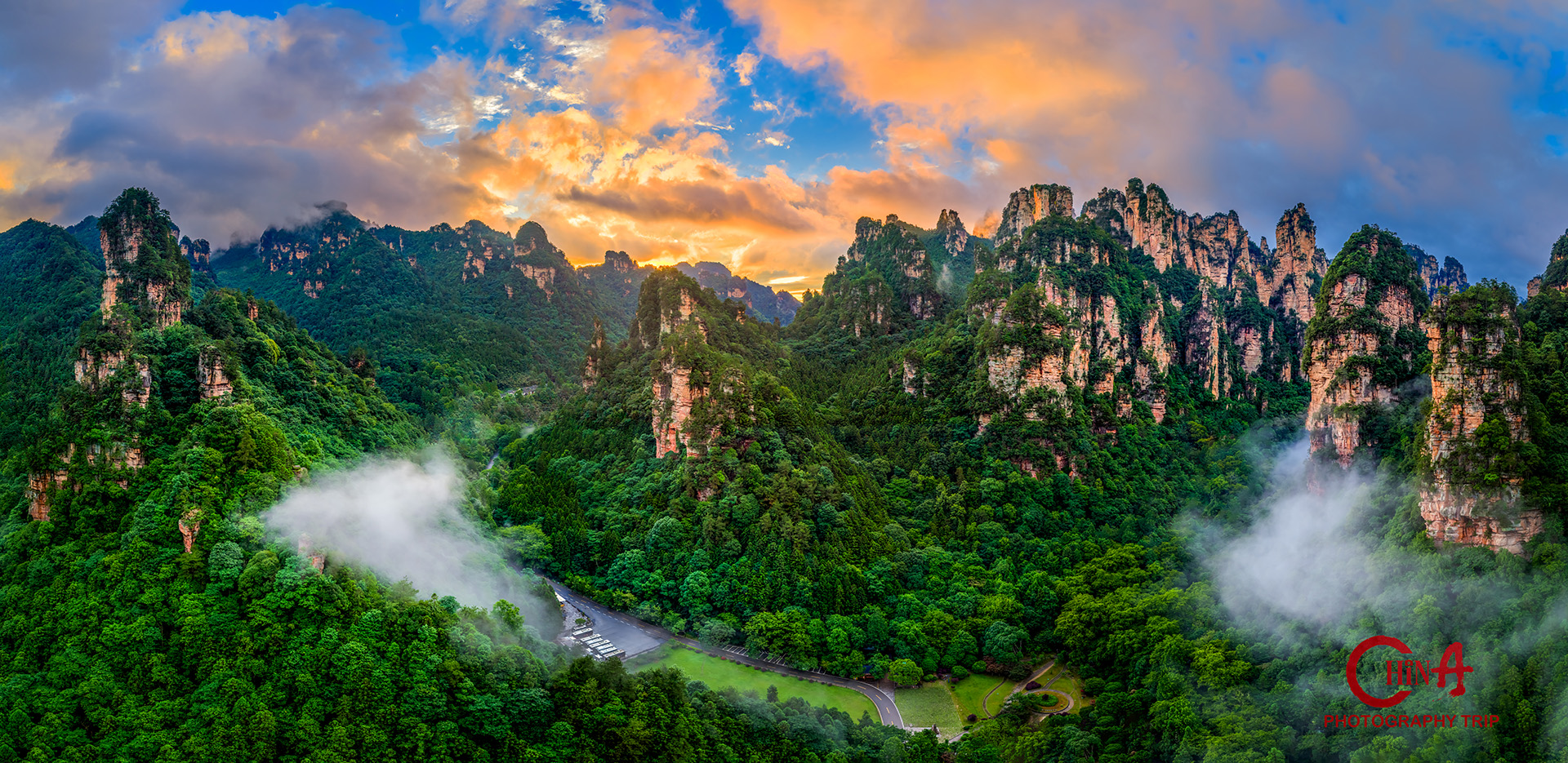 Morning cloud sea filling a Zhangjiajie canyon below the cliff-top path