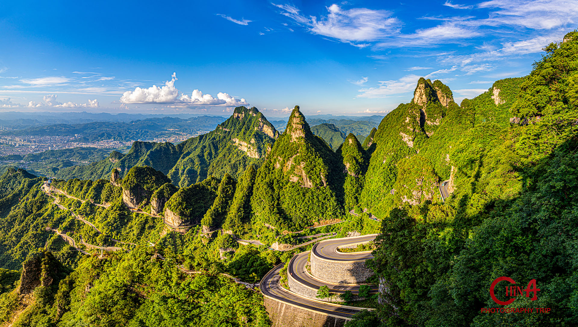 Panorama of Tianmen Cave with the winding mountain road below